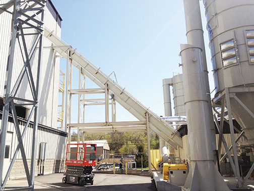 The redesigned L Path En-Masse Conveyor System effectively handled feedstock from truck unload to the storage silos.